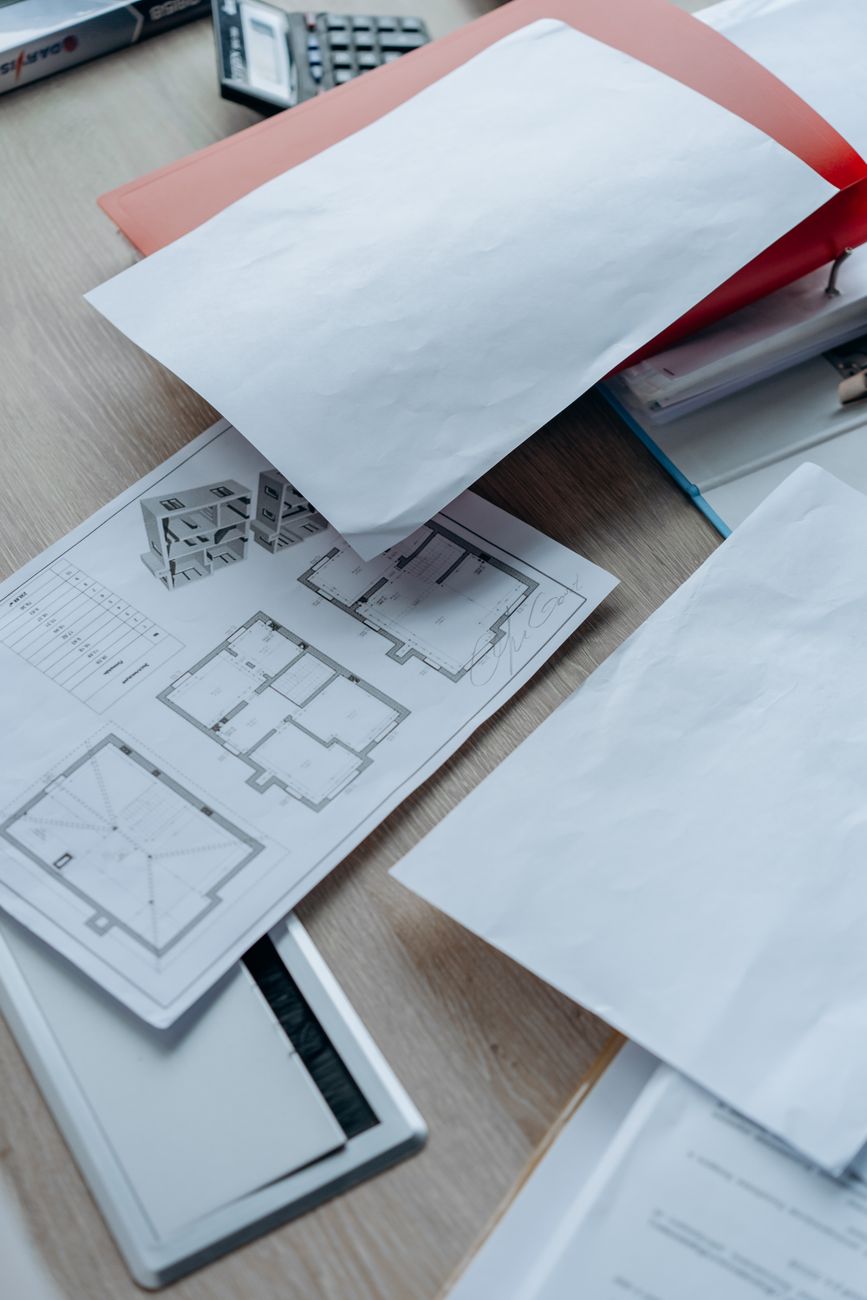 Floor plans and papers on a table